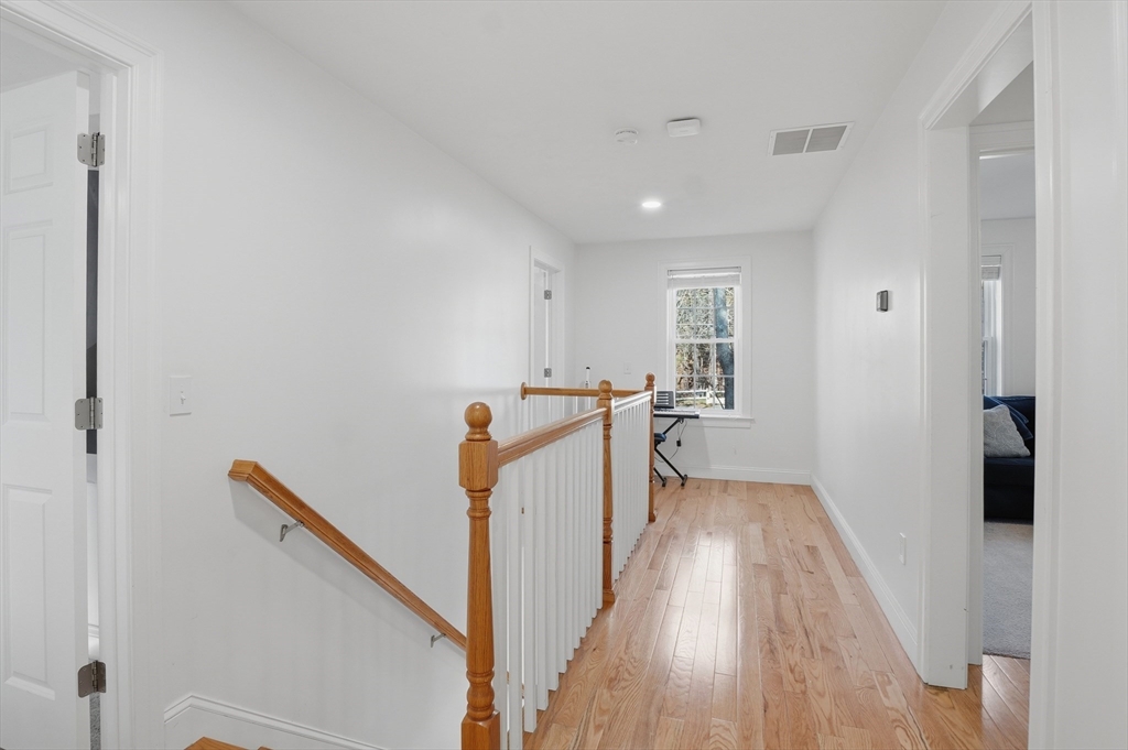 155 Turkey Hill Road Rutland, MA 01543 - Photo 12 of 38 a view of a hallway with wooden floor and staircase
