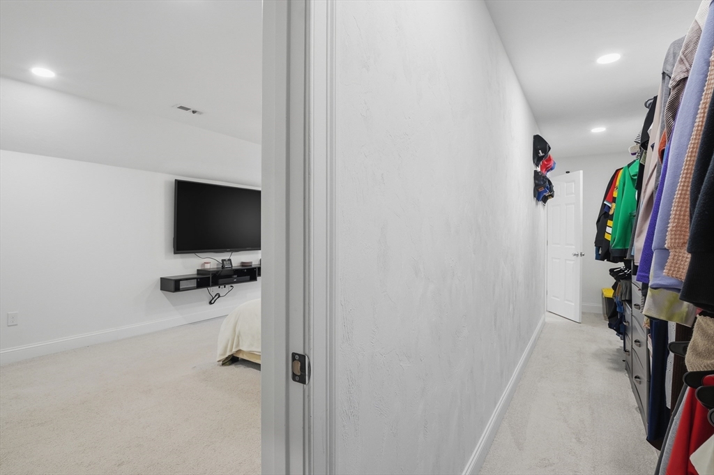 155 Turkey Hill Road Rutland, MA 01543 - Photo 22 of 38 a view of a livingroom with wooden floor and a flat screen tv