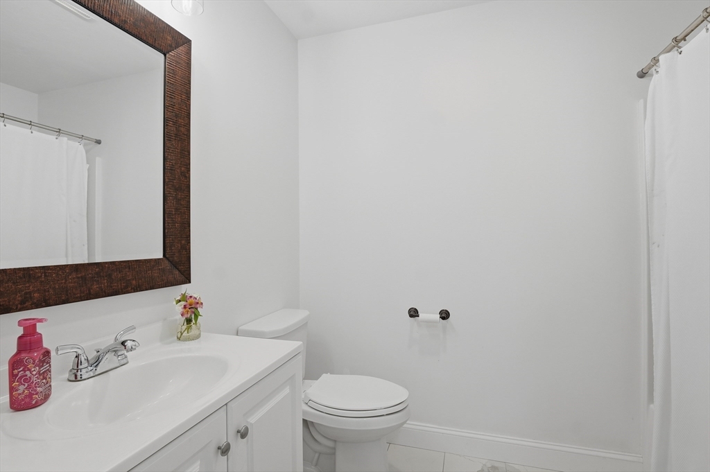 155 Turkey Hill Road Rutland, MA 01543 - Photo 26 of 38 a bathroom with a sink a toilet and a mirror