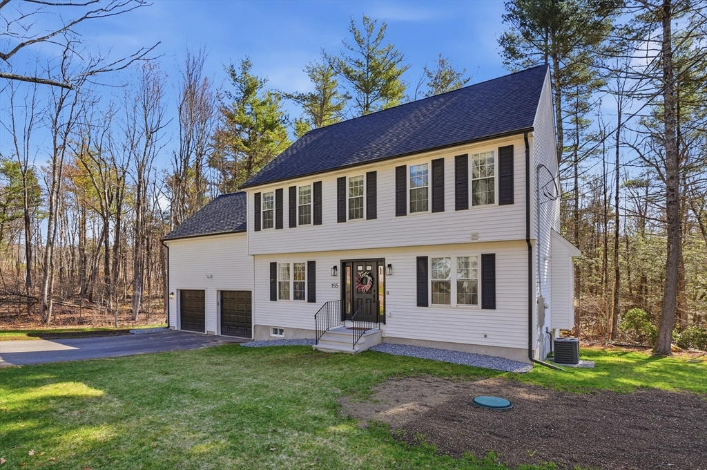 155 Turkey Hill Road Rutland, MA 01543 - Photo 32 of 38 a front view of a house with a garden
