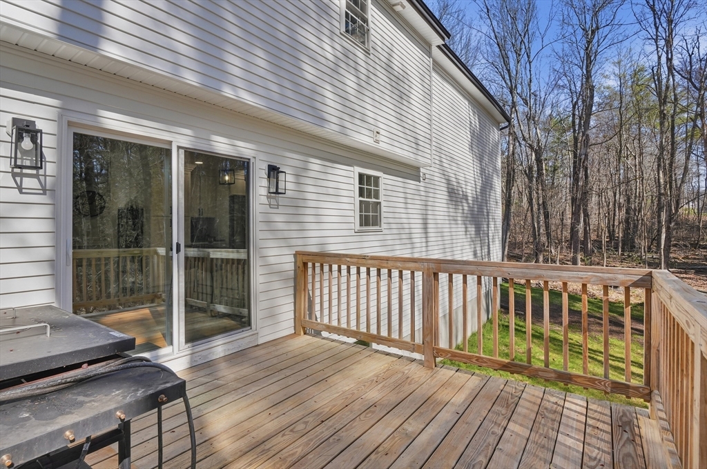 155 Turkey Hill Road Rutland, MA 01543 - Photo 34 of 38 a view of deck with wooden floor and outdoor seating