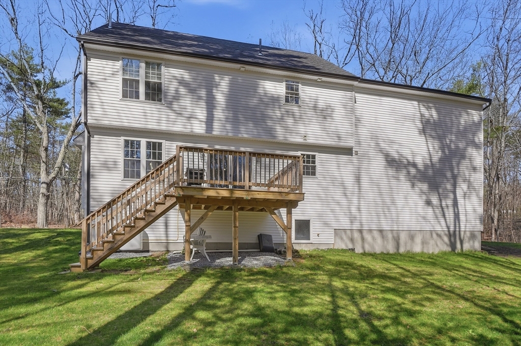155 Turkey Hill Road Rutland, MA 01543 - Photo 36 of 38 a view of a house with a yard