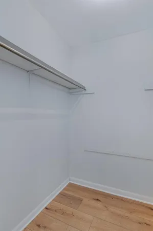a view of a room with shelf on the wall