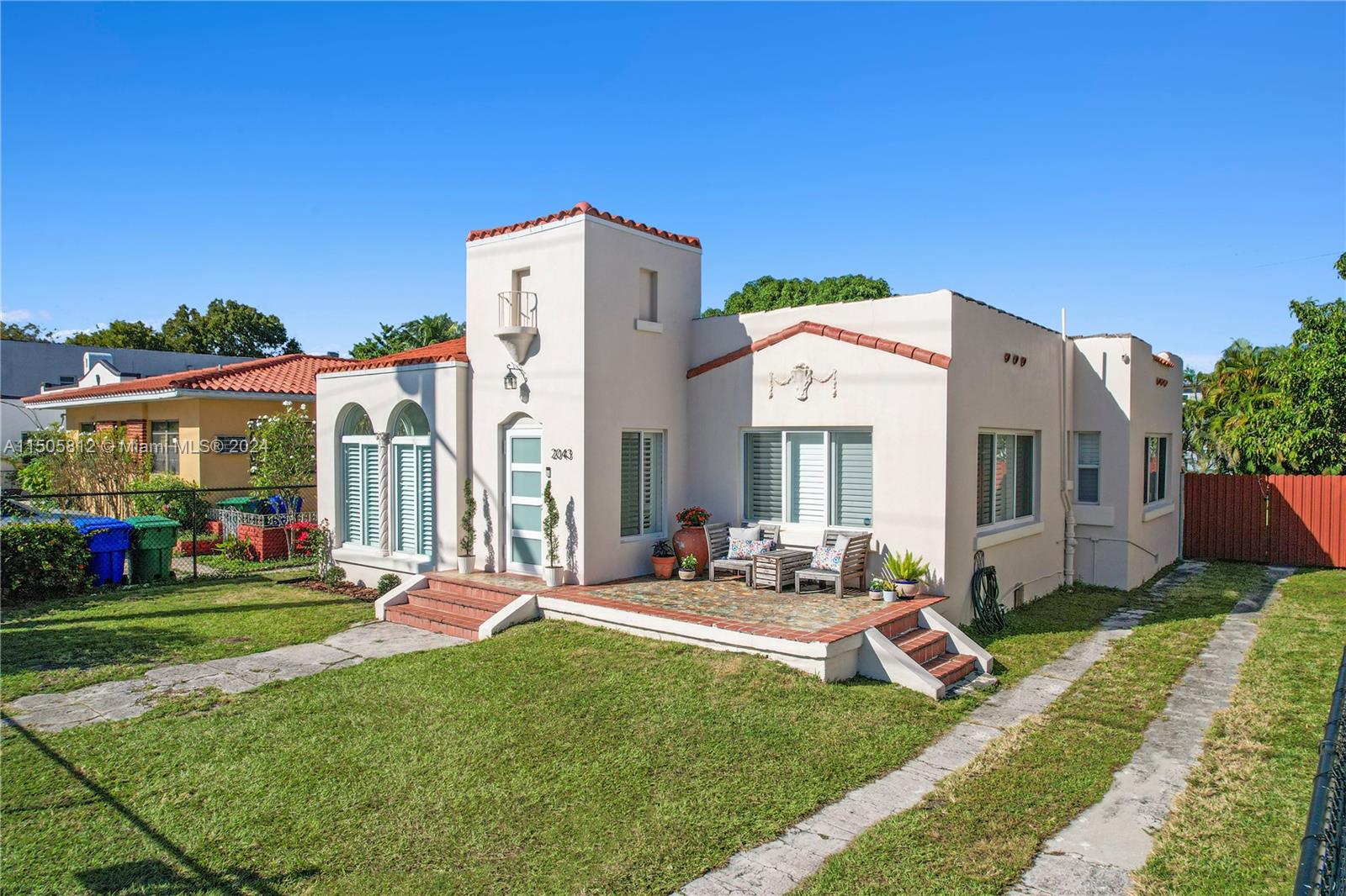 2043 Southwest 7th Street Miami, FL 33135 - Photo 1 of 37 a view of a house with backyard sitting area and garden