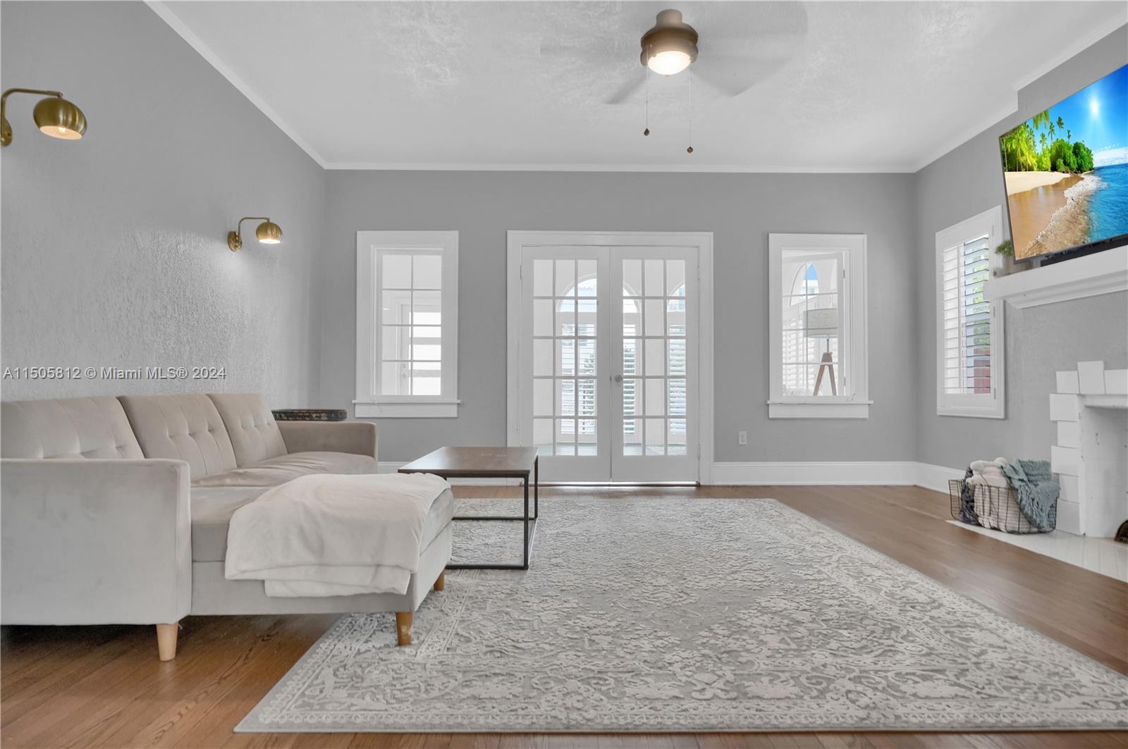 2043 Southwest 7th Street Miami, FL 33135 - Photo 11 of 37 a bedroom with a bed and wooden floor