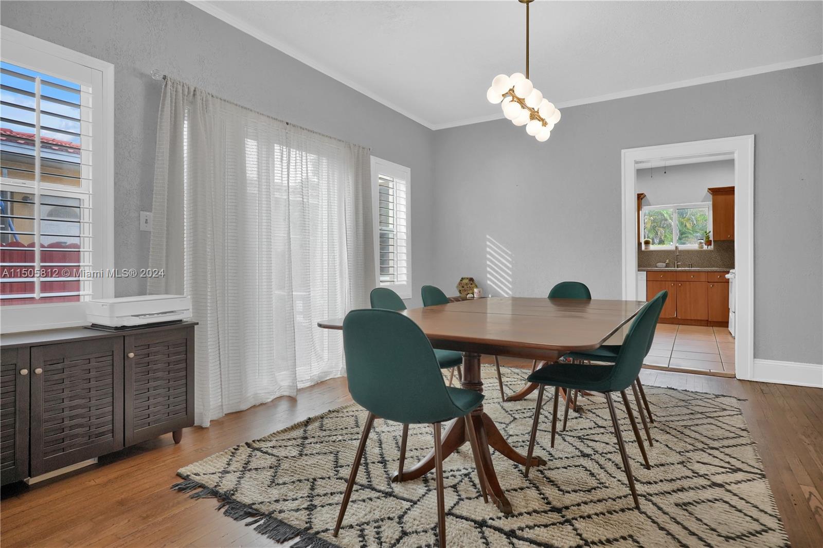 2043 Southwest 7th Street Miami, FL 33135 - Photo 13 of 37 a view of a dining room with furniture and chandelier