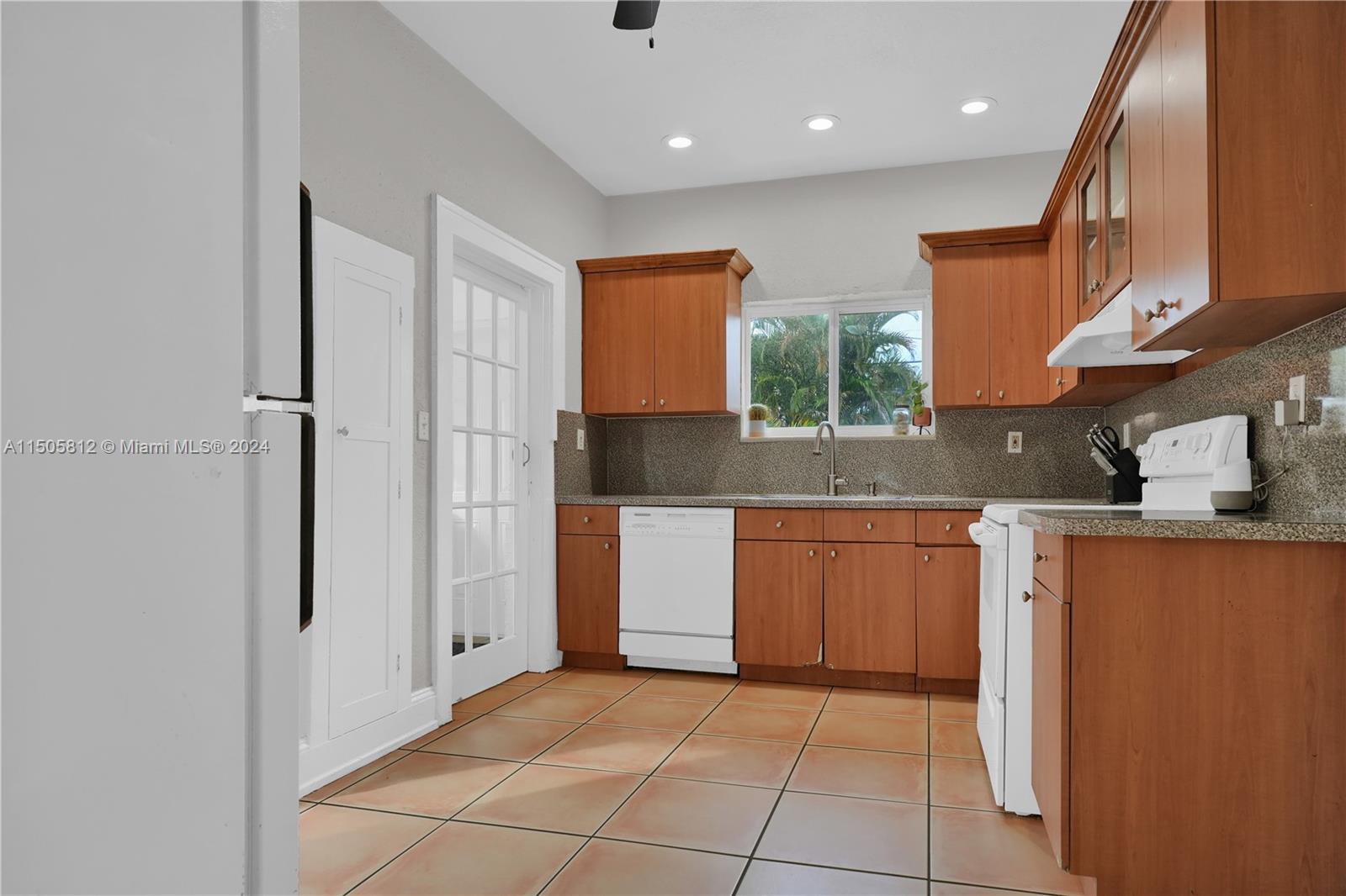 2043 Southwest 7th Street Miami, FL 33135 - Photo 15 of 37 a kitchen with stainless steel appliances granite countertop a refrigerator and a sink