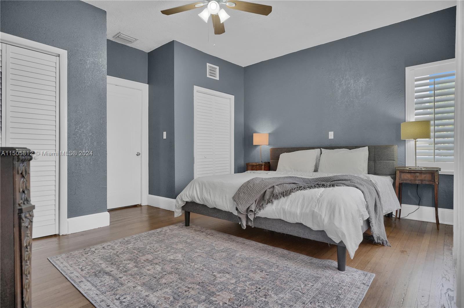 2043 Southwest 7th Street Miami, FL 33135 - Photo 20 of 37 a bedroom with a bed and a chandelier