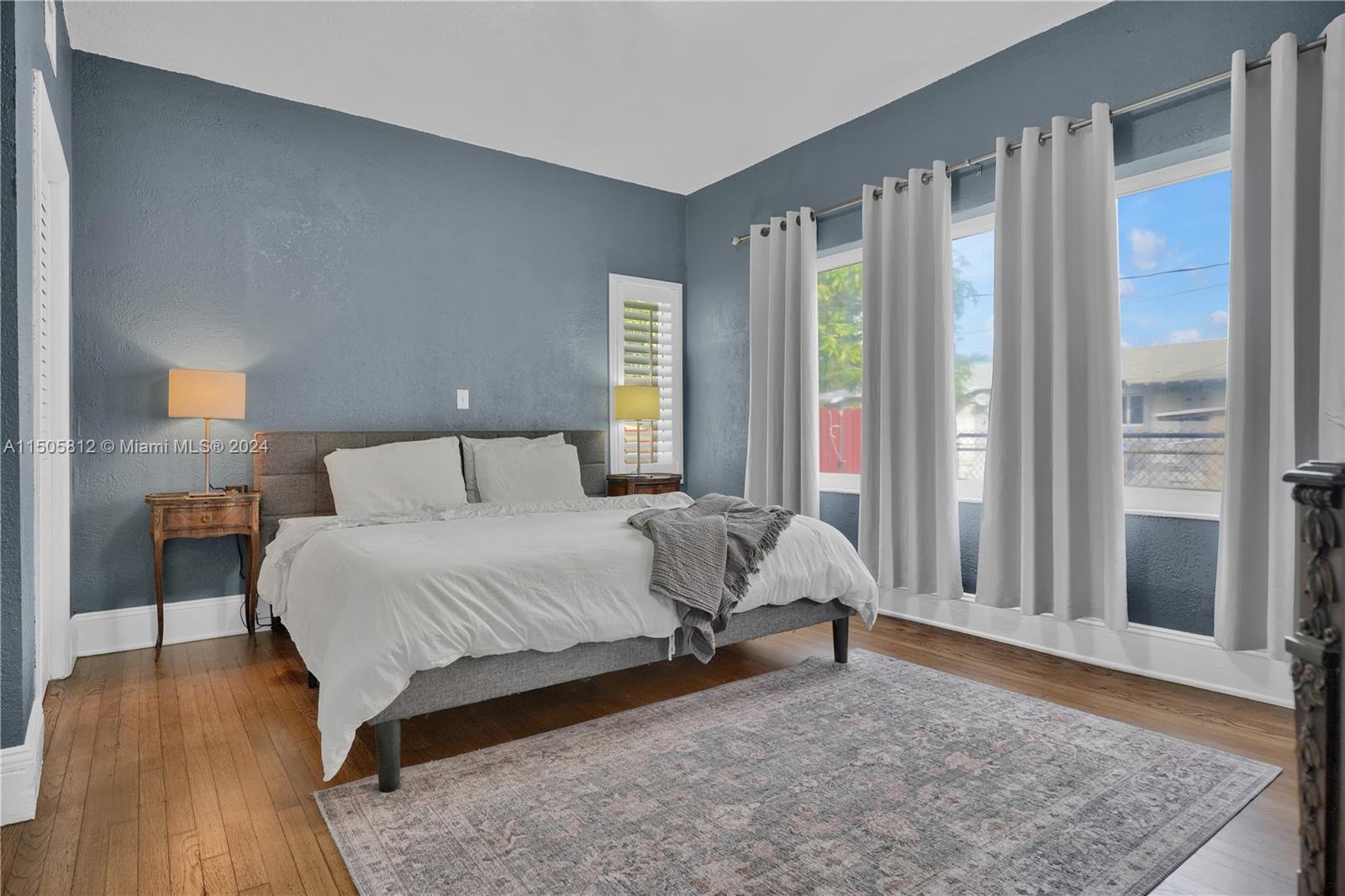 2043 Southwest 7th Street Miami, FL 33135 - Photo 21 of 37 a bedroom with a bed and a window