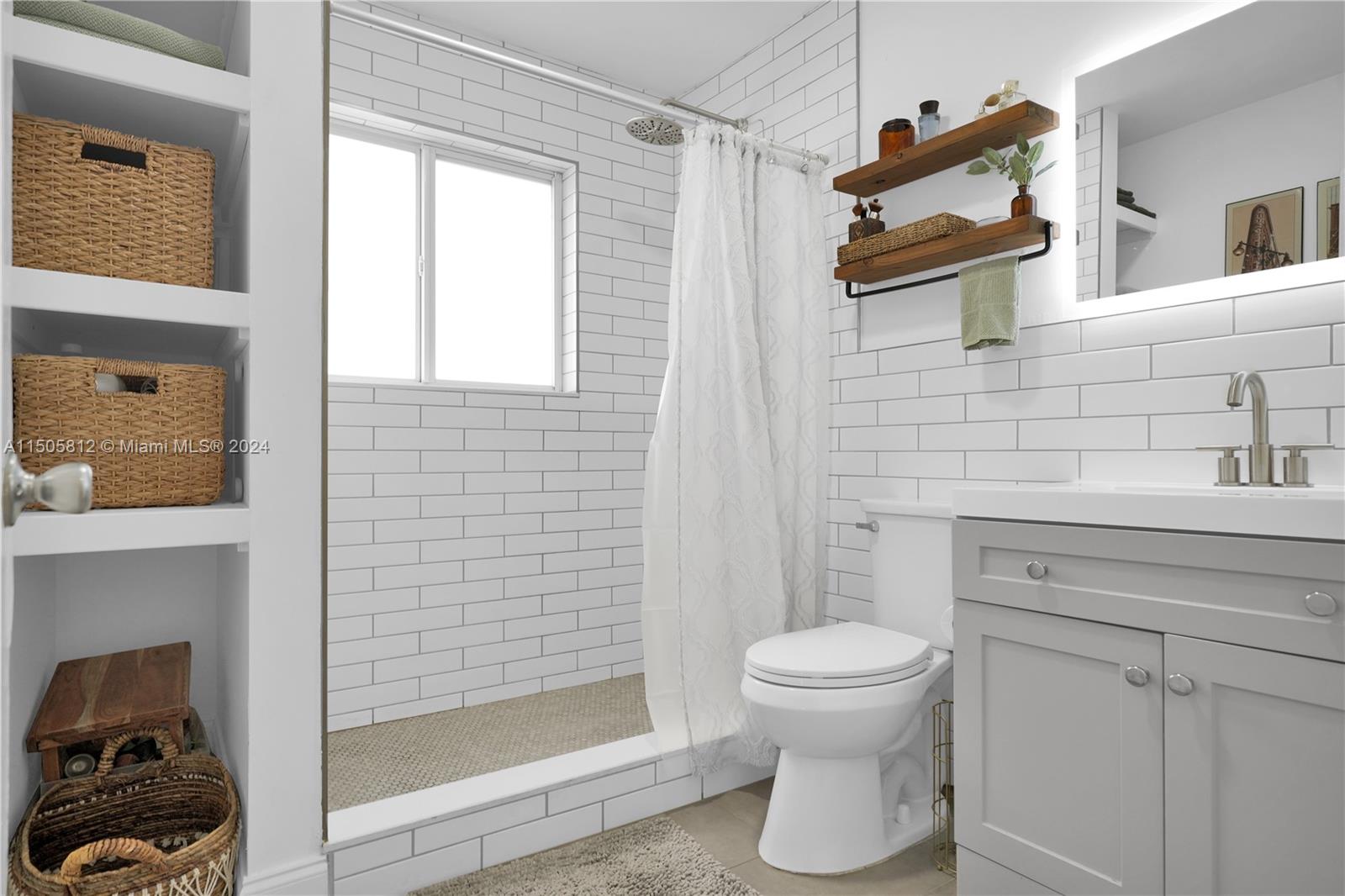 2043 Southwest 7th Street Miami, FL 33135 - Photo 25 of 37 a bathroom with a toilet and a shower