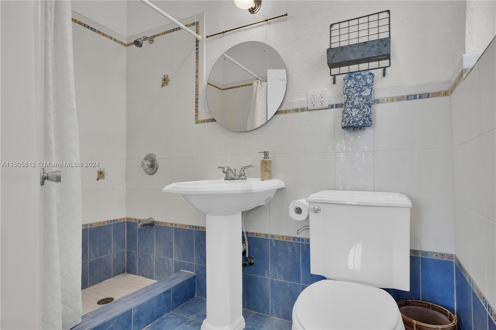 2043 Southwest 7th Street Miami, FL 33135 - Photo 26 of 37 a white toilet sitting next to a bathroom sink