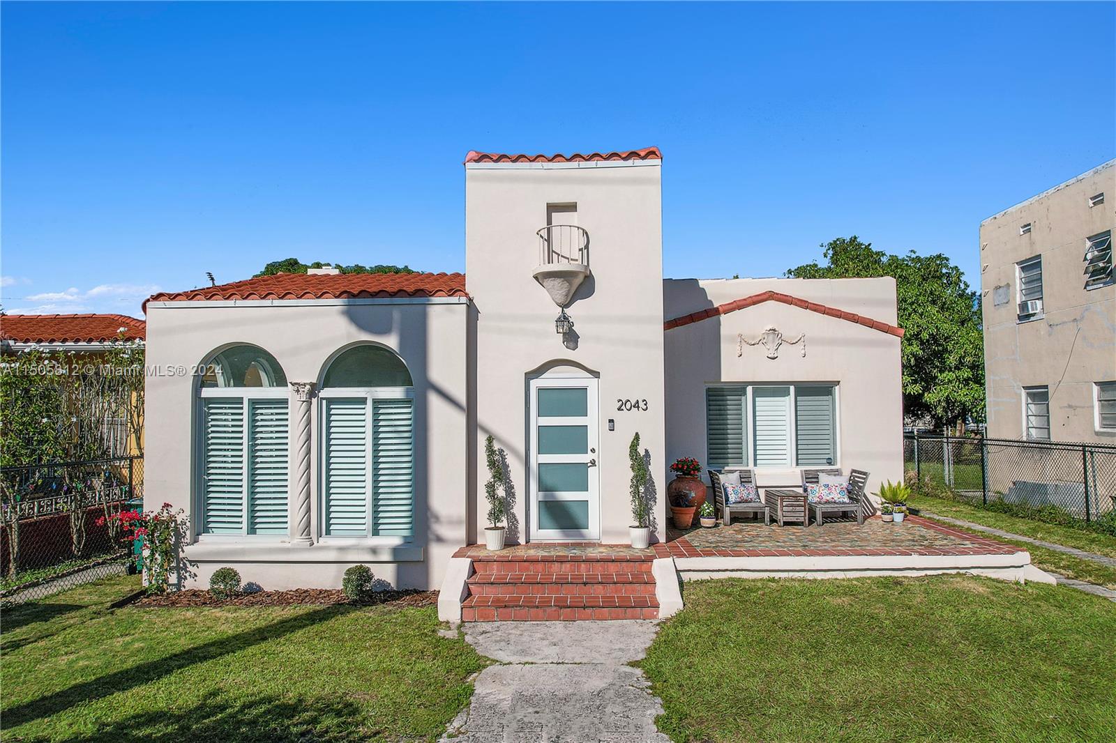 2043 Southwest 7th Street Miami, FL 33135 - Photo 29 of 37 a front view of a house with a yard
