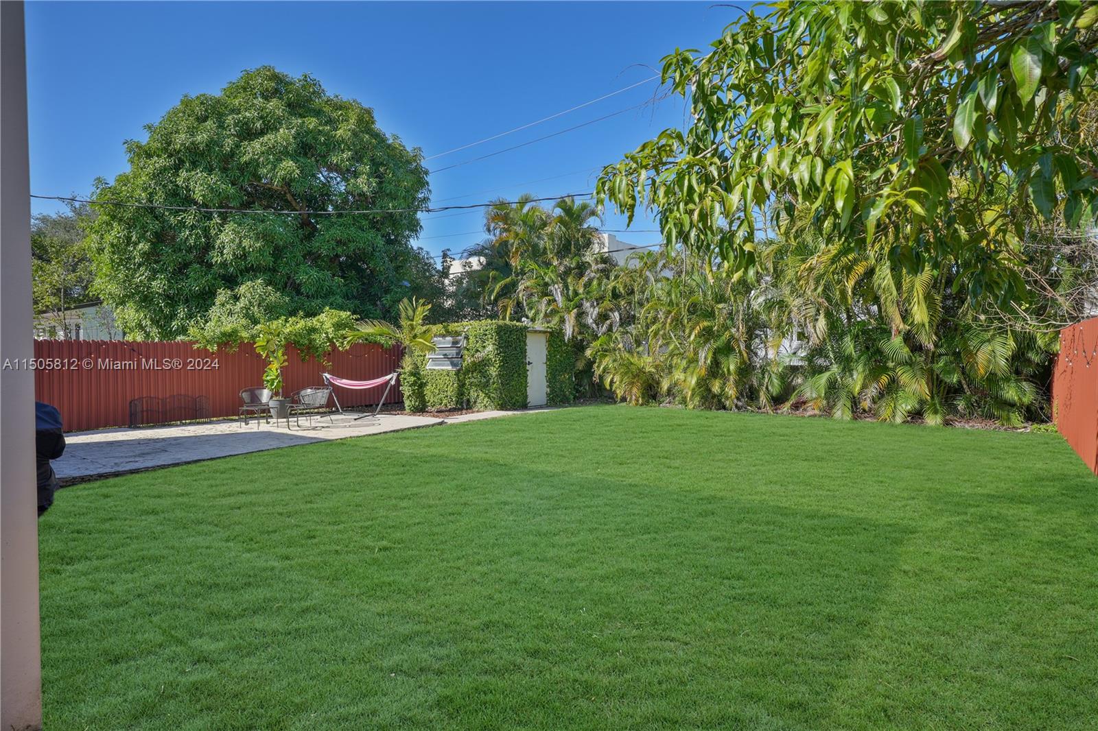 2043 Southwest 7th Street Miami, FL 33135 - Photo 35 of 37 a view of a wooden fence and trees