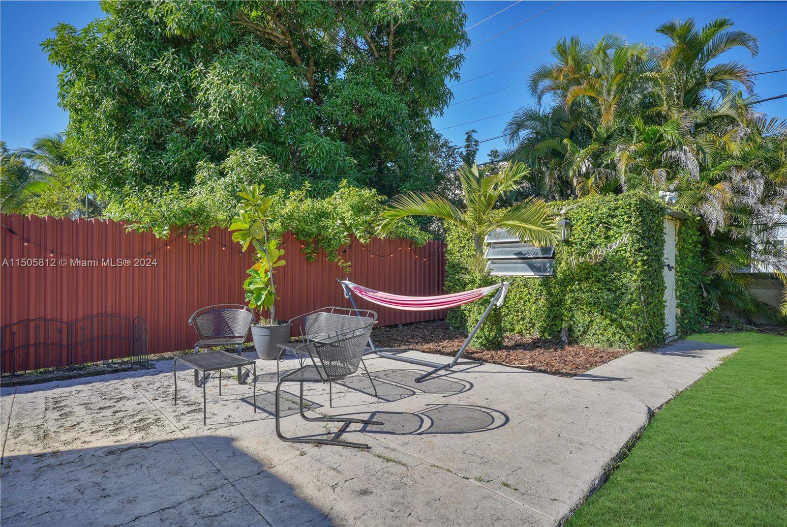 2043 Southwest 7th Street Miami, FL 33135 - Photo 37 of 37 a backyard of a house with table and chairs