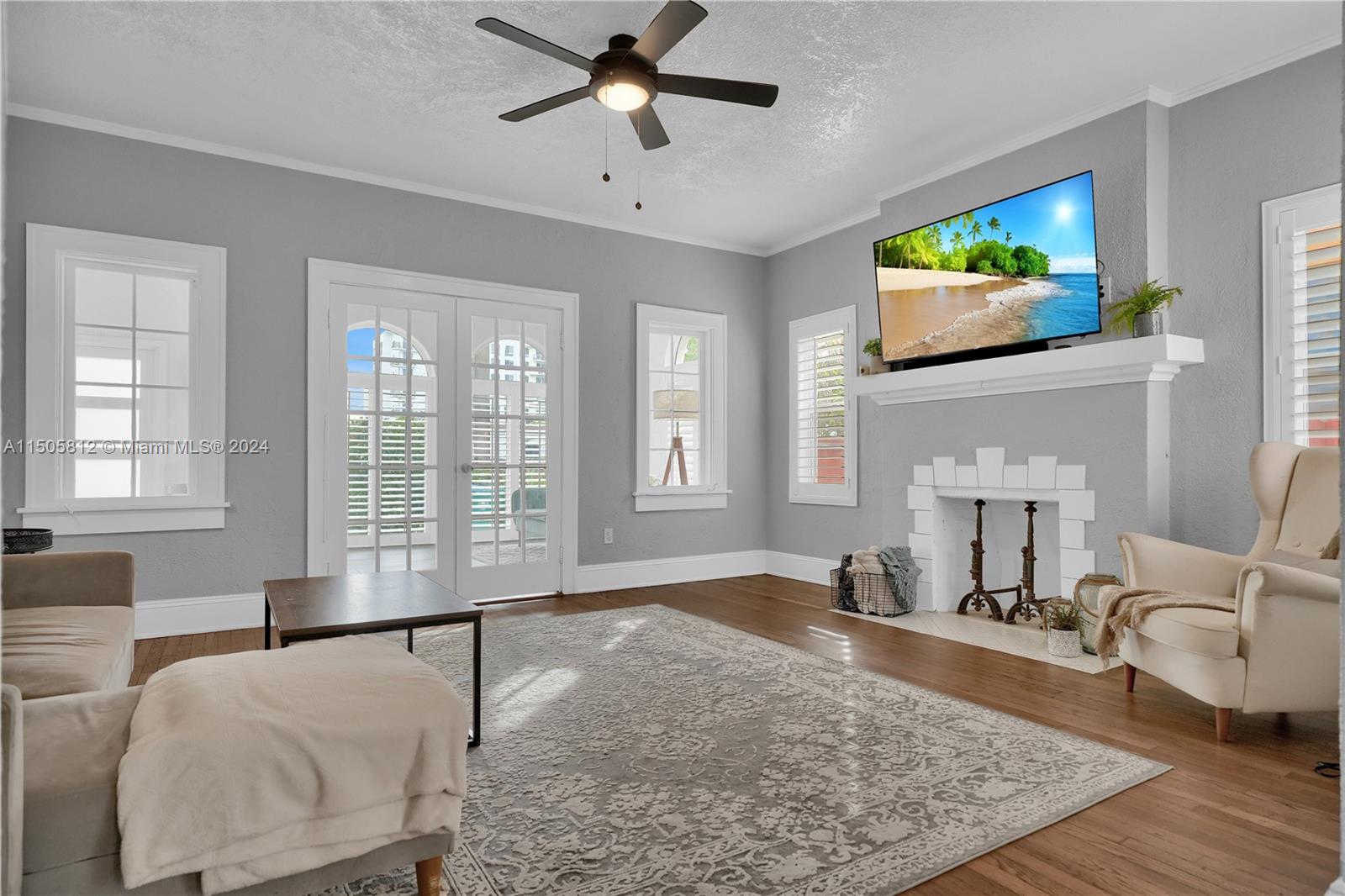 2043 Southwest 7th Street Miami, FL 33135 - Photo 9 of 37 a living room with furniture and a flat screen tv