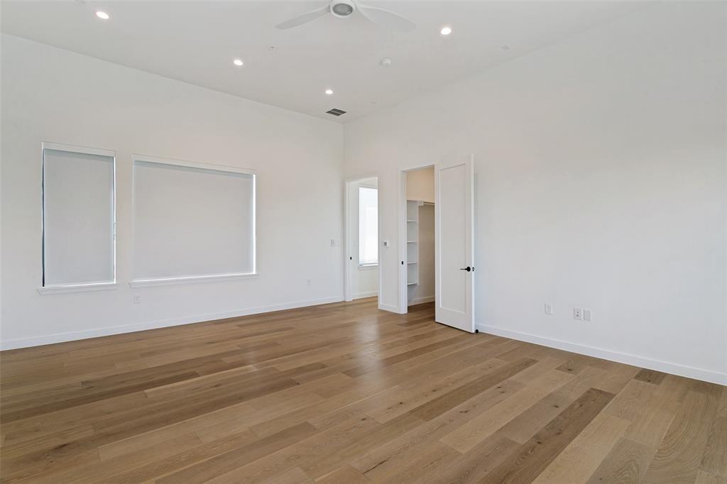 1111 Raiford Road, Unit 100 Carrollton, TX 75007 - Photo 21 of 33 Second primary bedroom with en suite full bathroom and walk in closet. This space would be perfect for multi-generational or game/media room! Has access to deck with pergola. (3rd floor)