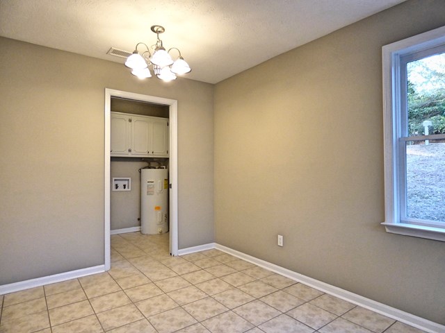 20 Ford Road Phenix City, AL 36869 - Photo 7 of 15 a view of a chandelier in big room and a bathroom