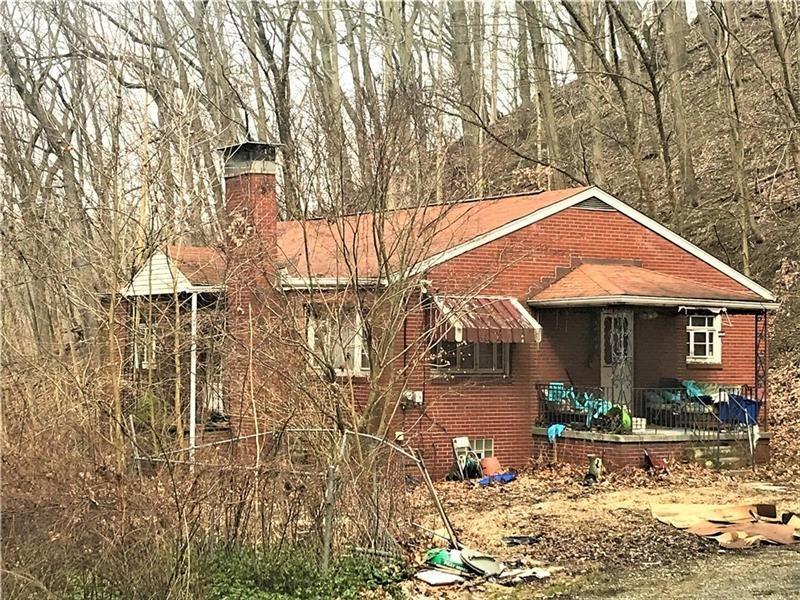 109 Wayne Street Aliquippa, PA 15001 - Photo 2 of 7 a front view of a house with garden