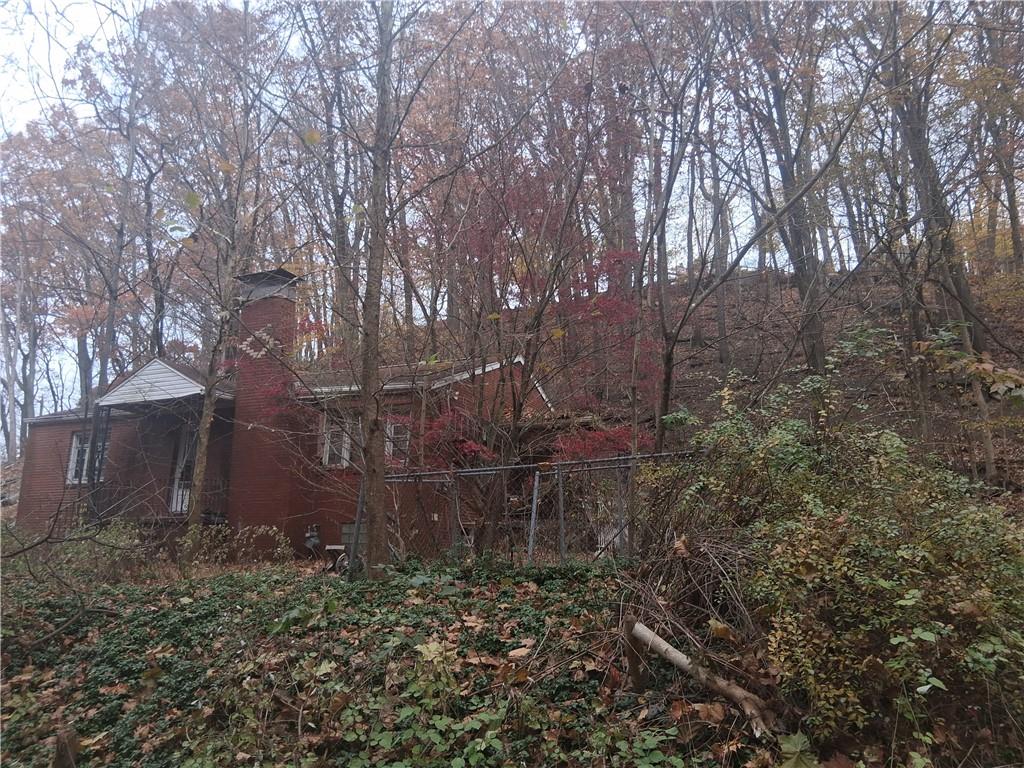 109 Wayne Street Aliquippa, PA 15001 - Photo 5 of 7 a backyard of a house with lots of green space