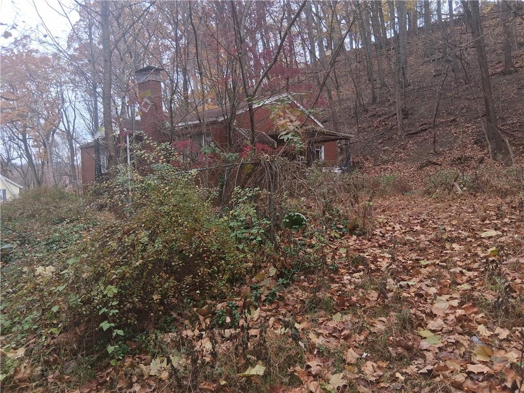 109 Wayne Street Aliquippa, PA 15001 - Photo 6 of 7 a backyard of a house with lots of green space