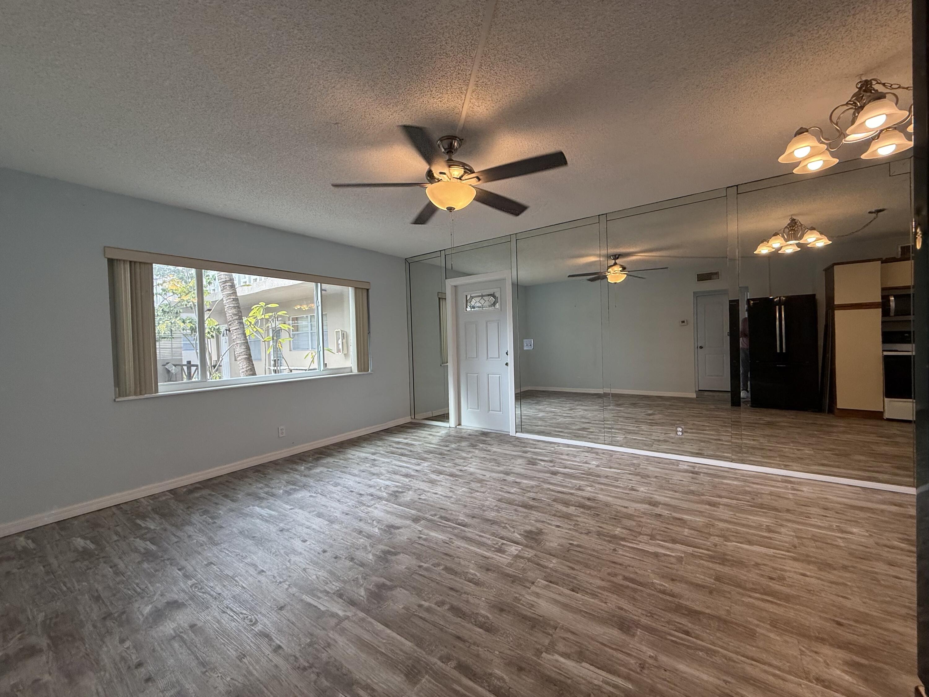 500 Southwest 15th Street, Unit 109 Pompano Beach, FL 33060 - Photo 13 of 17 a view of an empty room with a window
