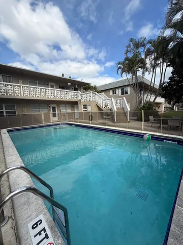 a view of a swimming pool with a garden