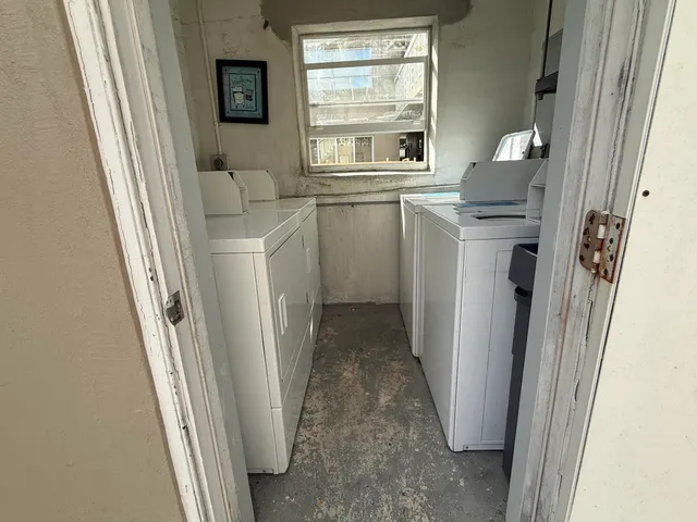 a utility room with a window dryer and washer