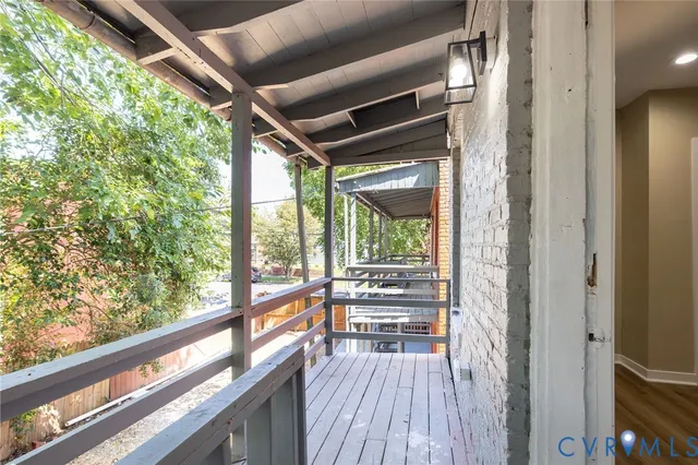 a view of balcony with wooden floor