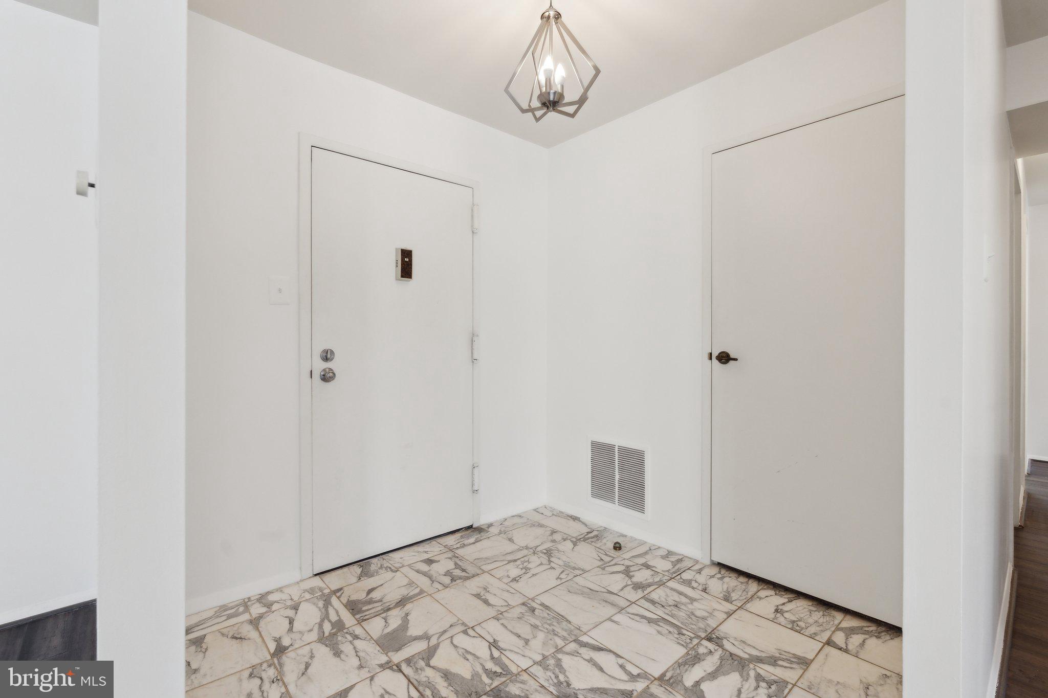 3031 Borge Street, Unit 211 Oakton, VA 22124 - Photo 3 of 35 Unit #211 Foyer
