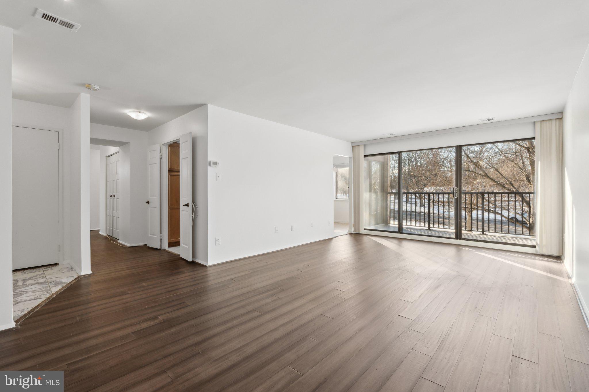 3031 Borge Street, Unit 211 Oakton, VA 22124 - Photo 4 of 35 Light-Filled Living Room