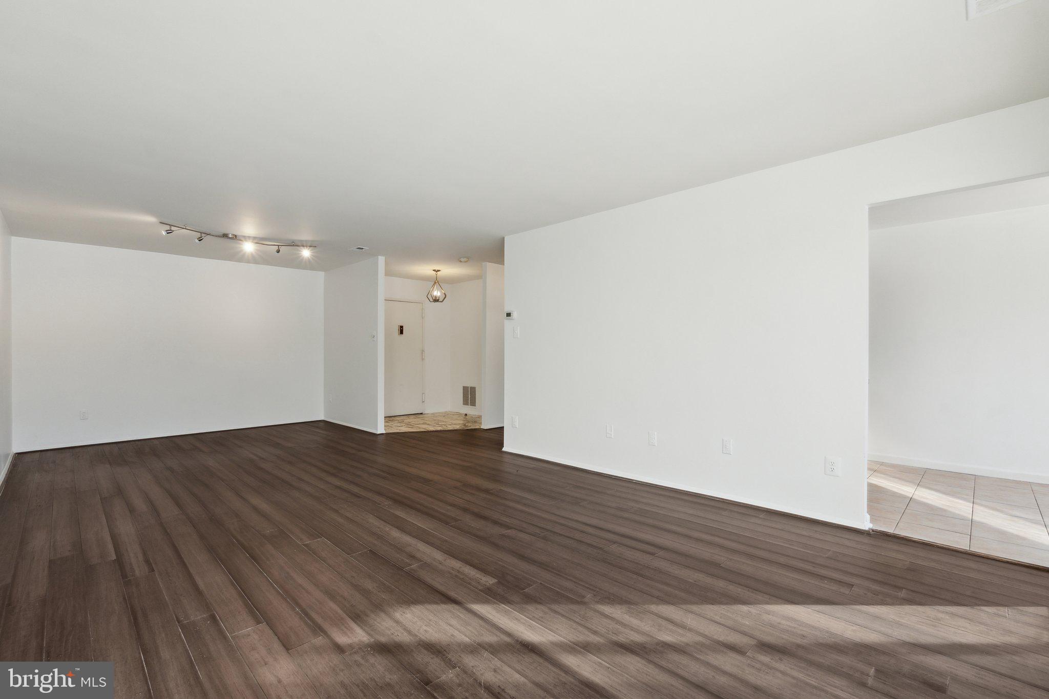 3031 Borge Street, Unit 211 Oakton, VA 22124 - Photo 8 of 35 Open Living & Dining Areas