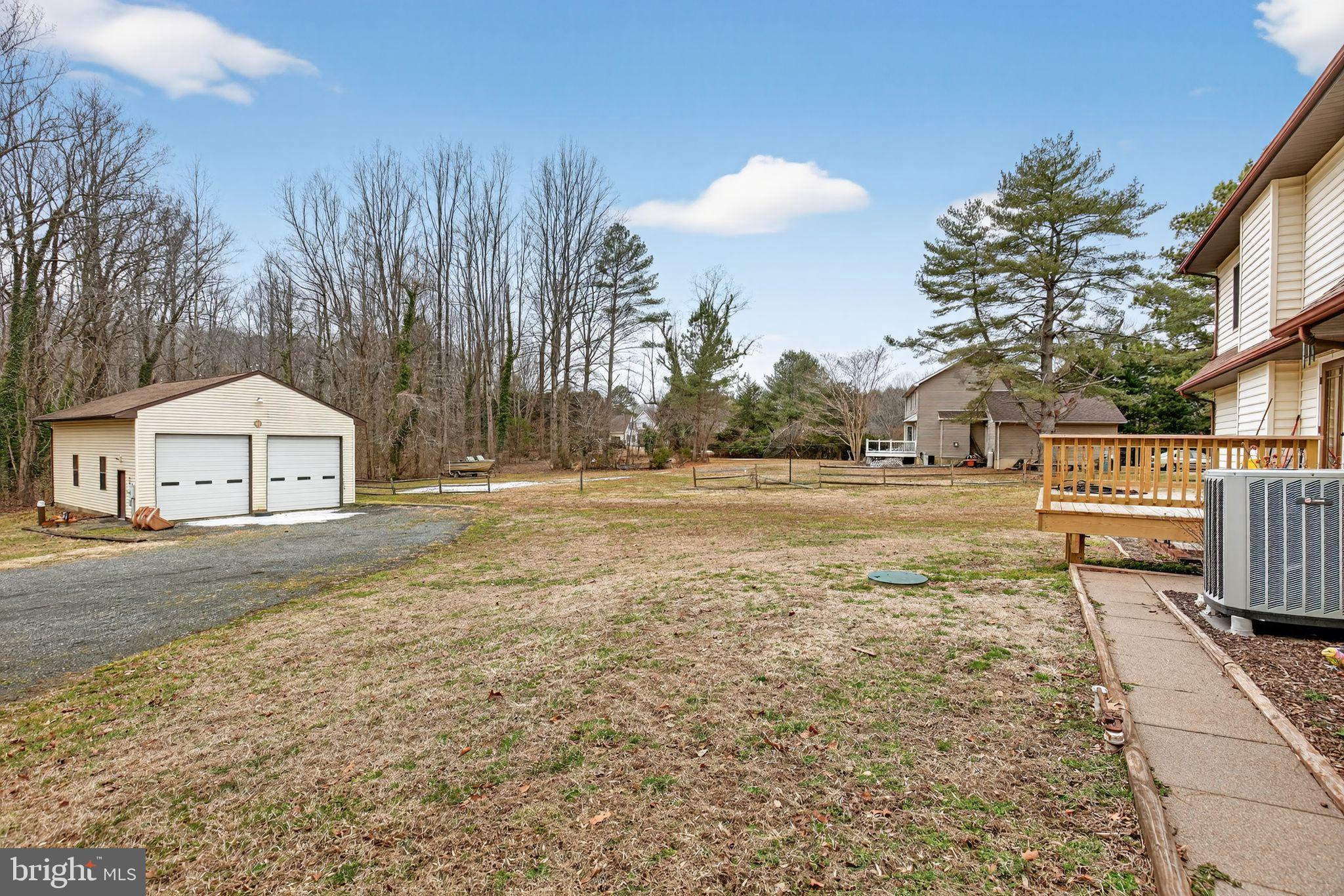 43447 Drum Cliff Road Hollywood, MD 20636 - Photo 13 of 37 Spacious yard with serene wooded backdrop.