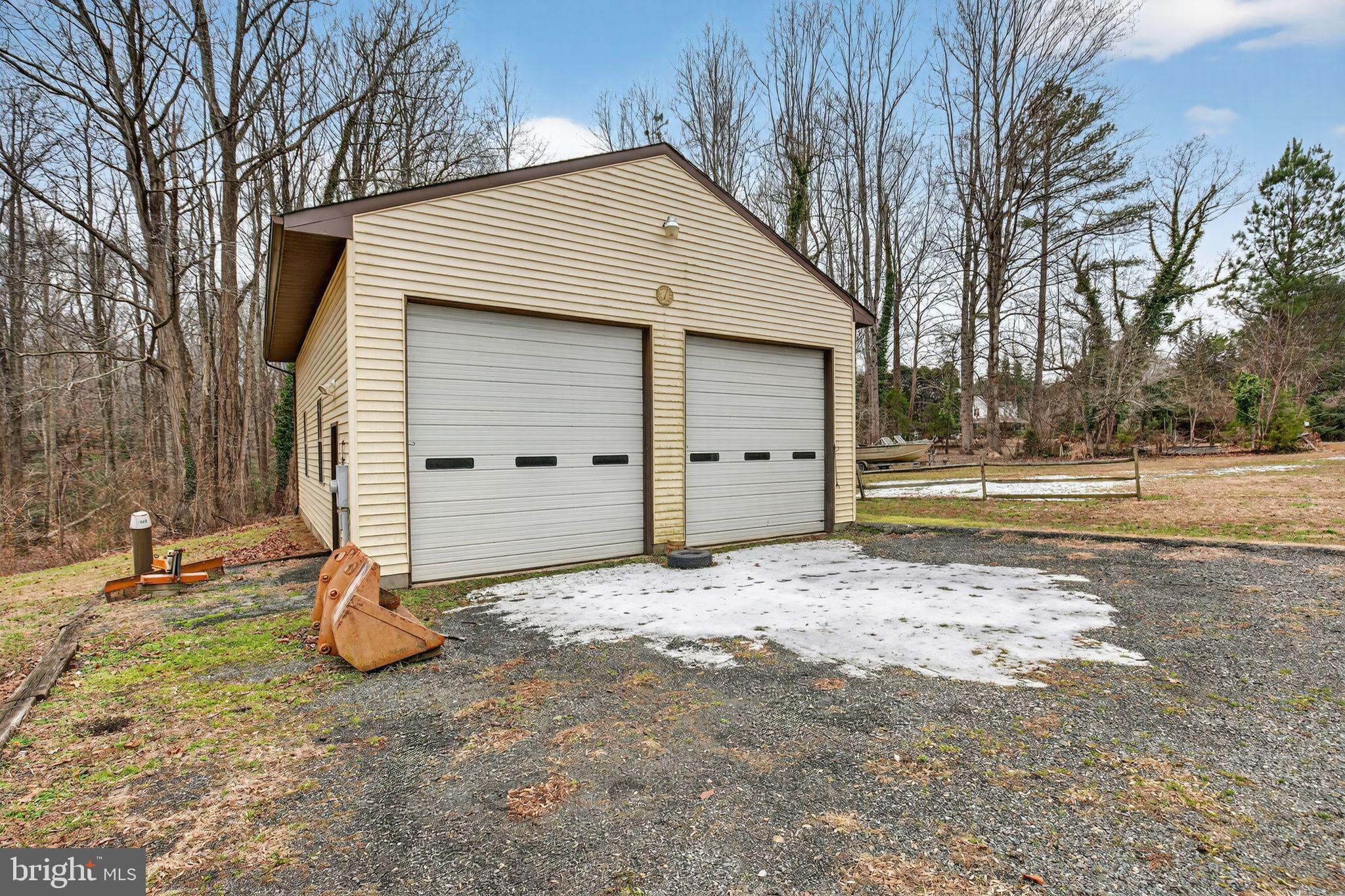 43447 Drum Cliff Road Hollywood, MD 20636 - Photo 14 of 37 Spacious garage nestled in serene surroundings.