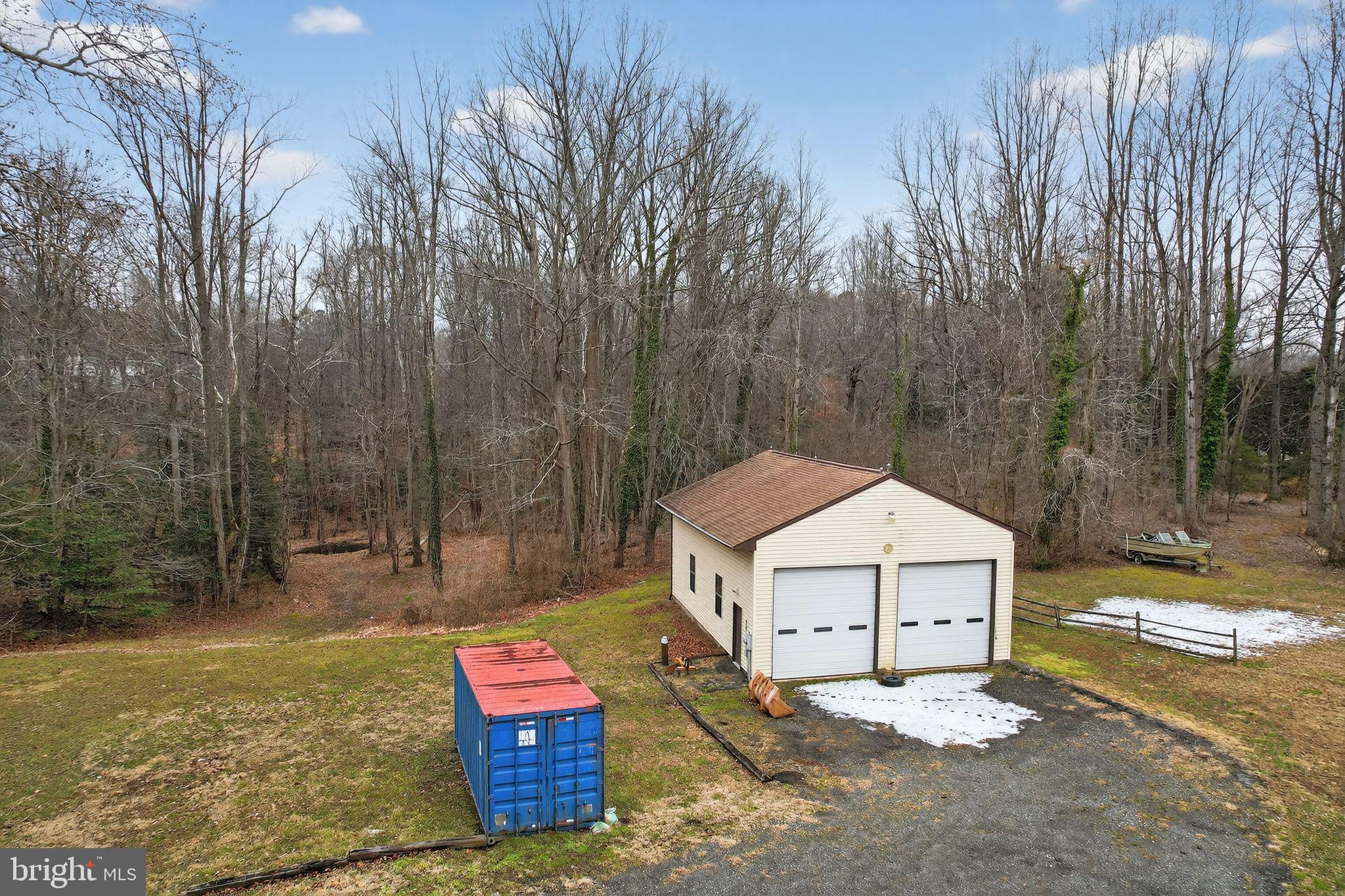 43447 Drum Cliff Road Hollywood, MD 20636 - Photo 9 of 37 Charming garage nestled in serene woods.