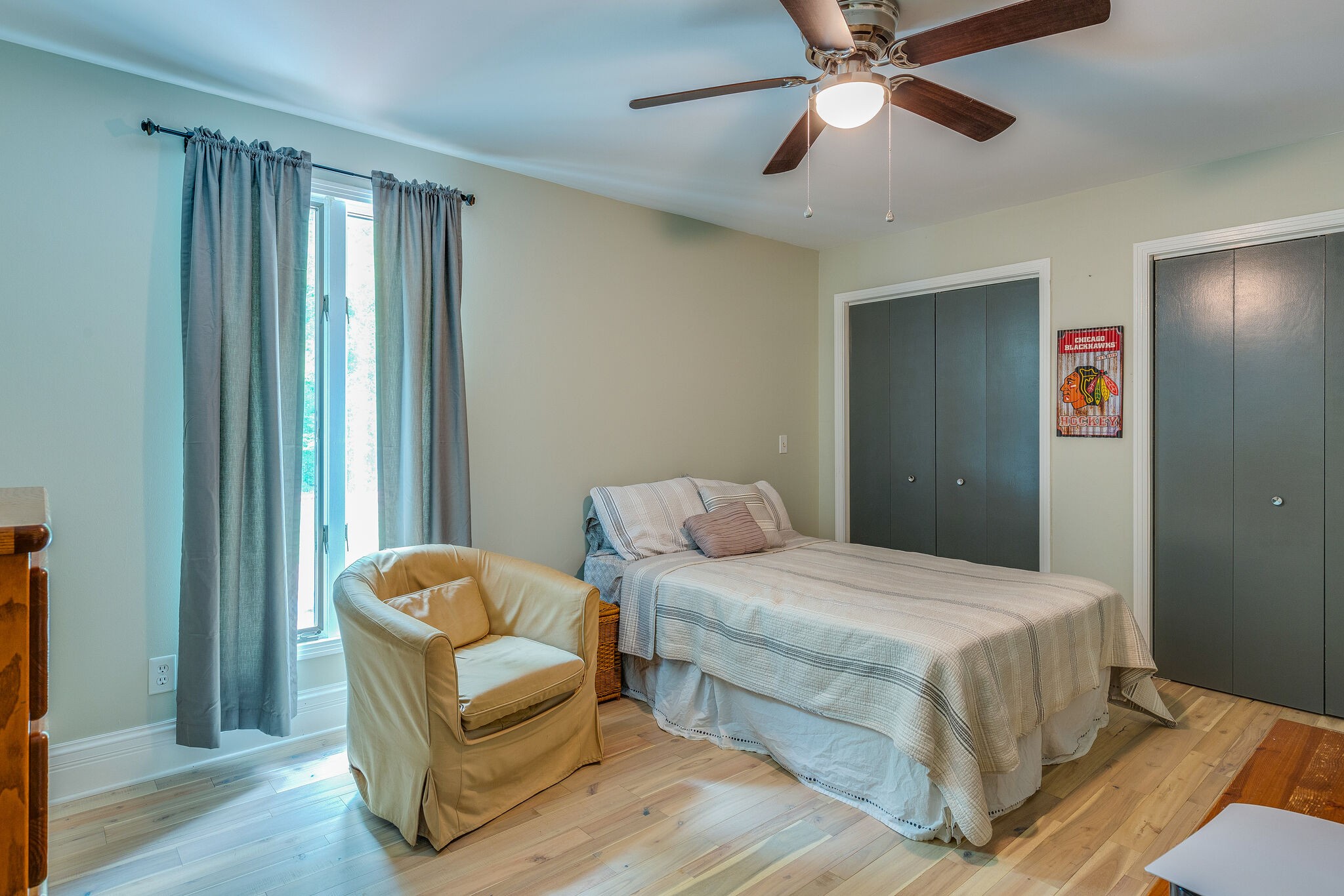 21 Cooks Road Mount Juliet, TN 37122 - Photo 16 of 35 a bedroom with a bed and a chandelier