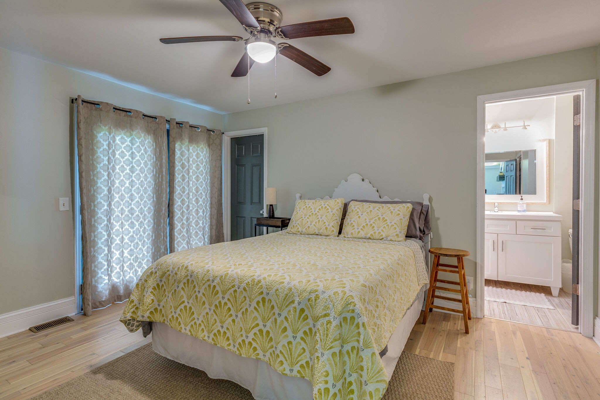 21 Cooks Road Mount Juliet, TN 37122 - Photo 19 of 35 a bedroom with a bed and a chandelier
