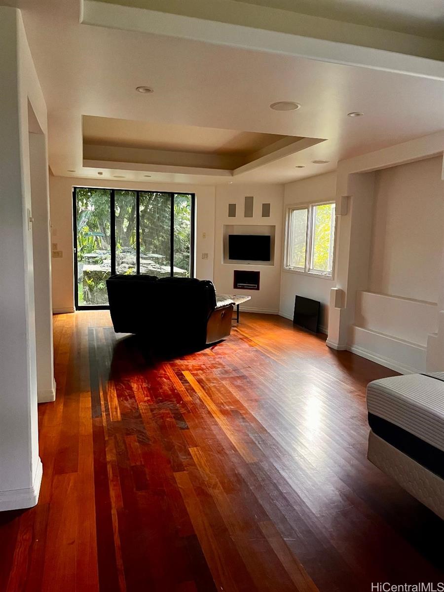 59-530 Hoalike Road Haleiwa, HI 96712 - Photo 6 of 25 a living room with furniture fireplace and flat screen tv