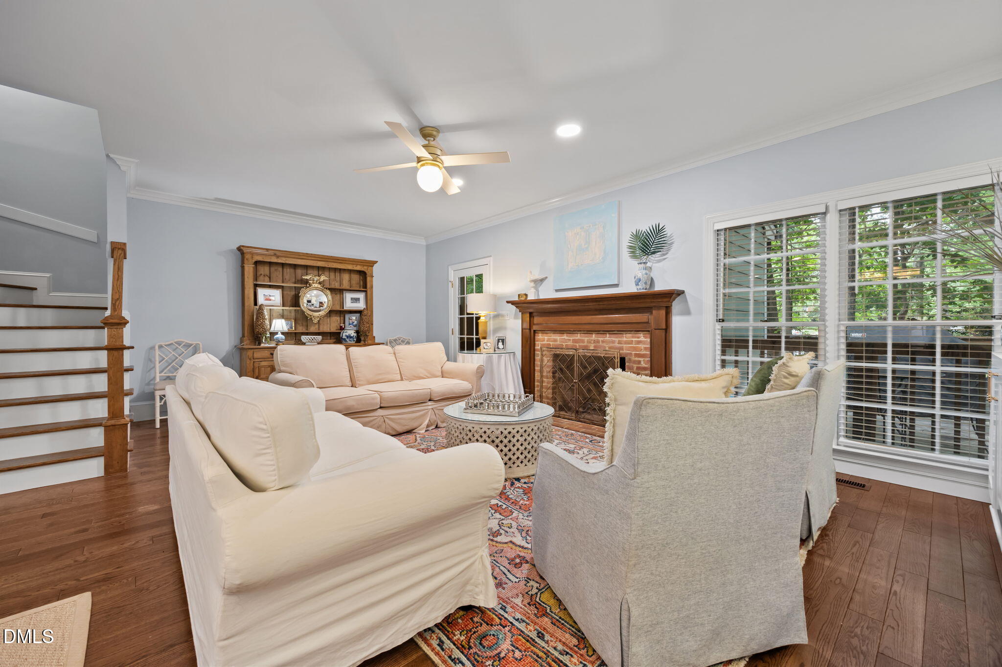 562 Weathergreen Drive Raleigh, NC 27615 - Photo 14 of 47 a living room with furniture a fireplace and a large window