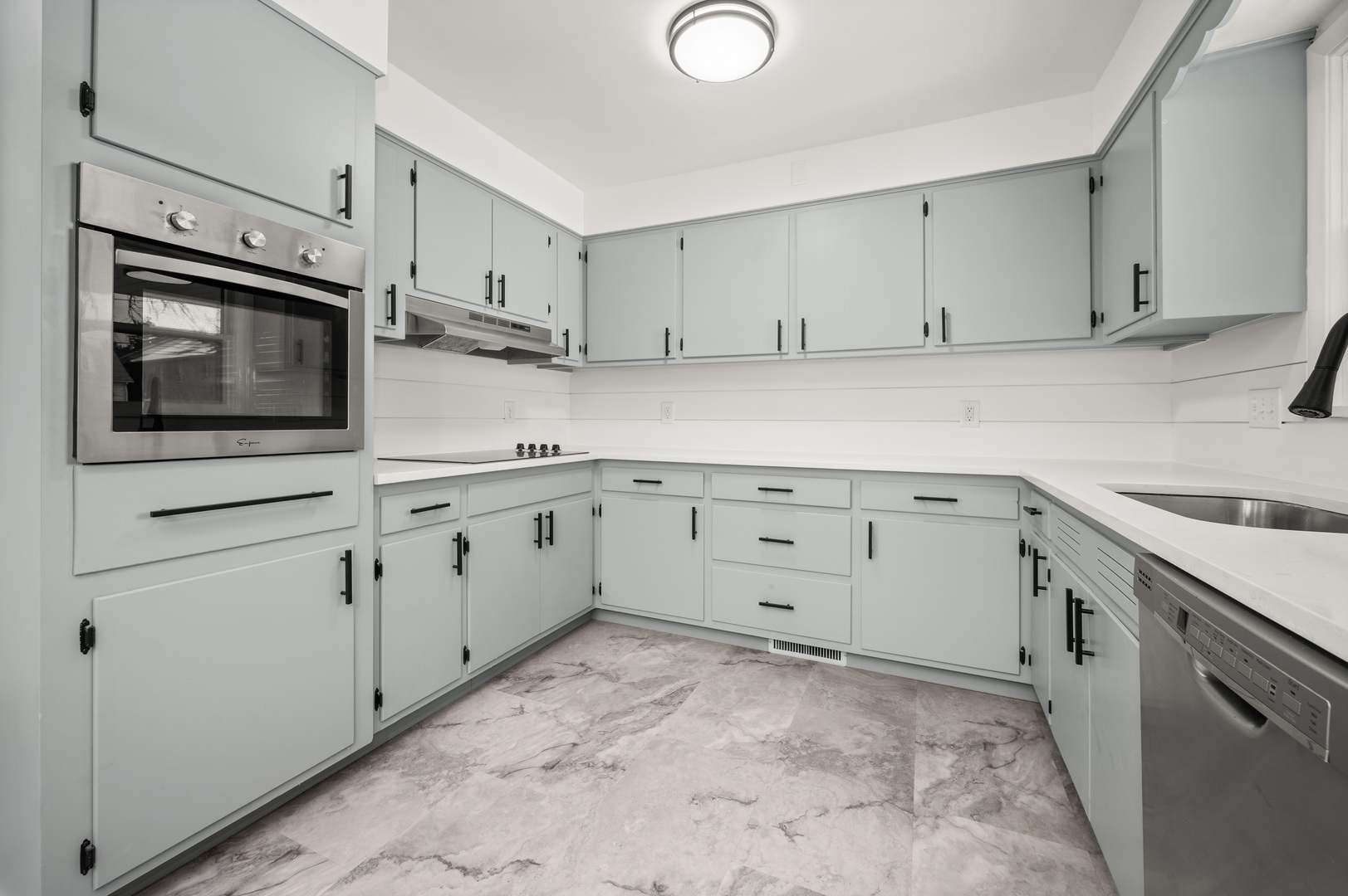 804 Normal Road DeKalb, IL 60115 - Photo 13 of 27 a kitchen with cabinets stainless steel appliances and sink