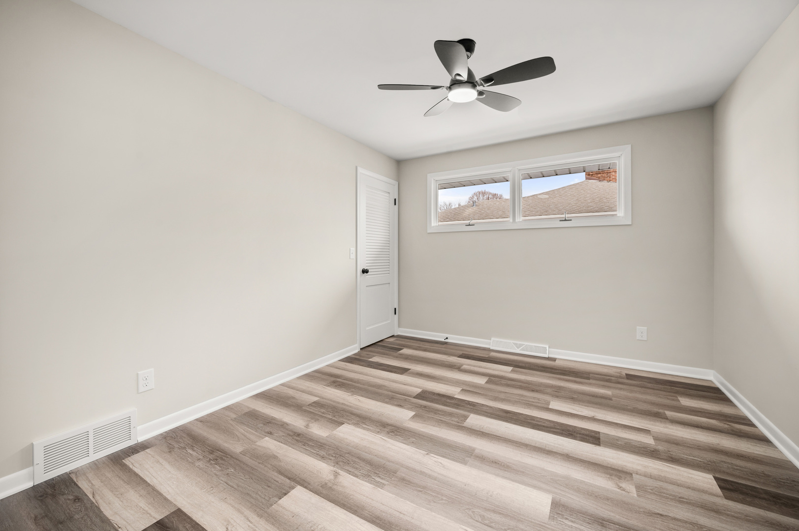 804 Normal Road DeKalb, IL 60115 - Photo 18 of 27 a view of room with window and ceiling fan