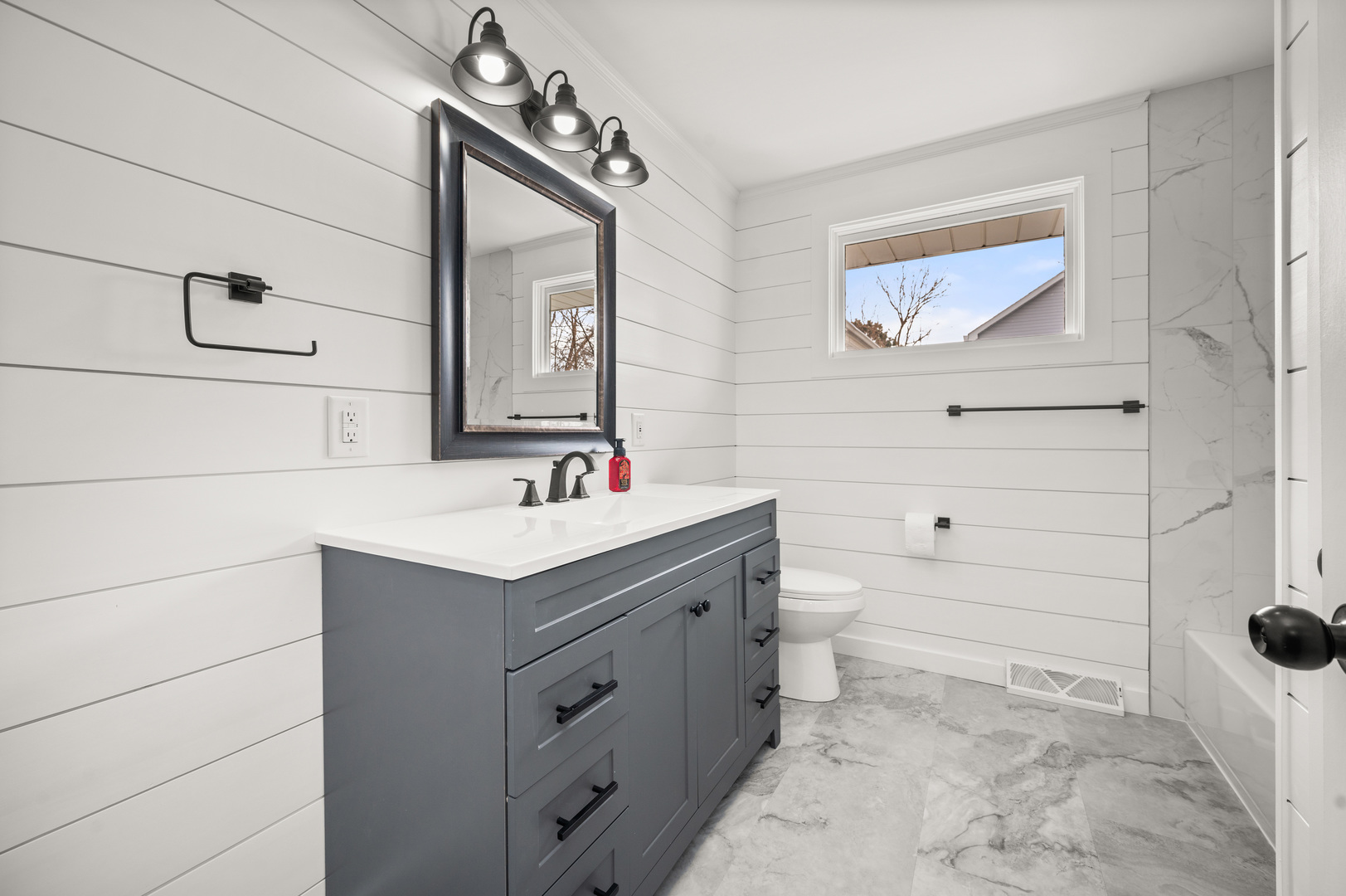 804 Normal Road DeKalb, IL 60115 - Photo 19 of 27 a bathroom with a sink vanity and toilet
