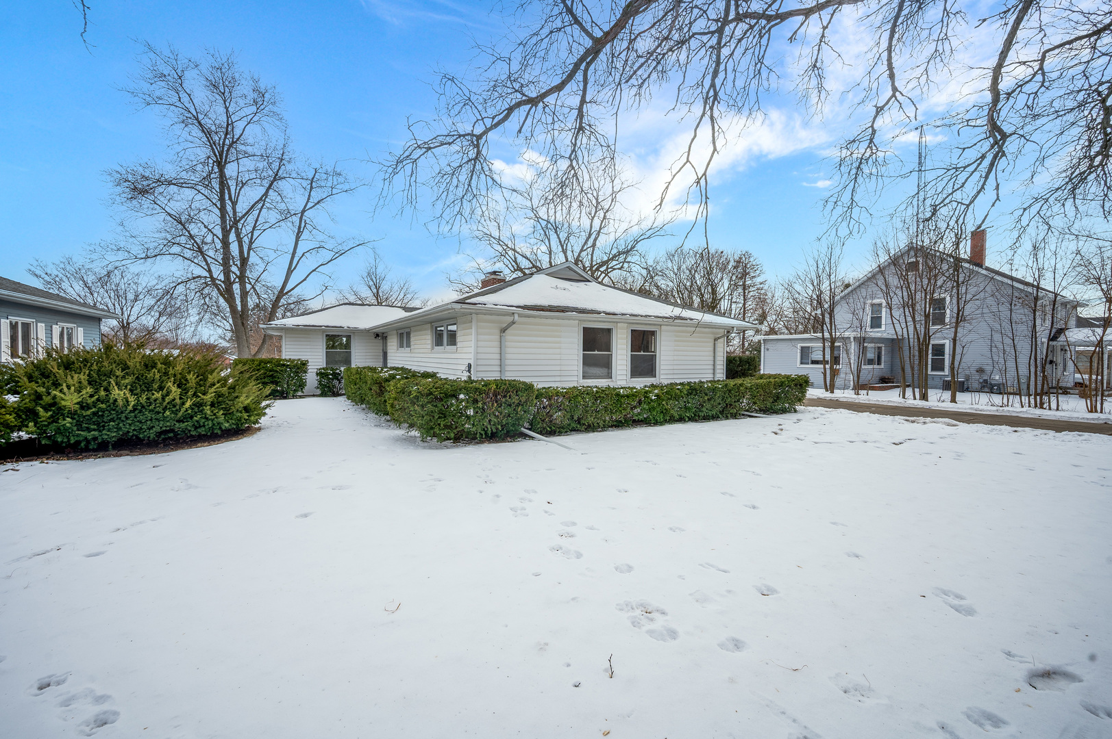804 Normal Road DeKalb, IL 60115 - Photo 2 of 27 a front view of a house with a yard and large trees