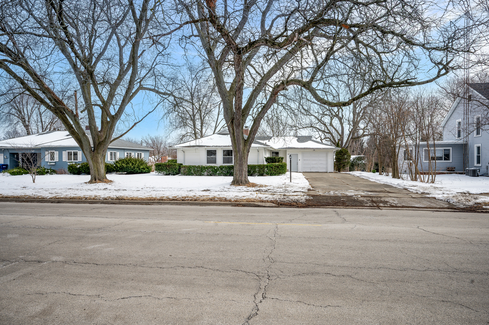 804 Normal Road DeKalb, IL 60115 - Photo 3 of 27 a view of road with house and trees