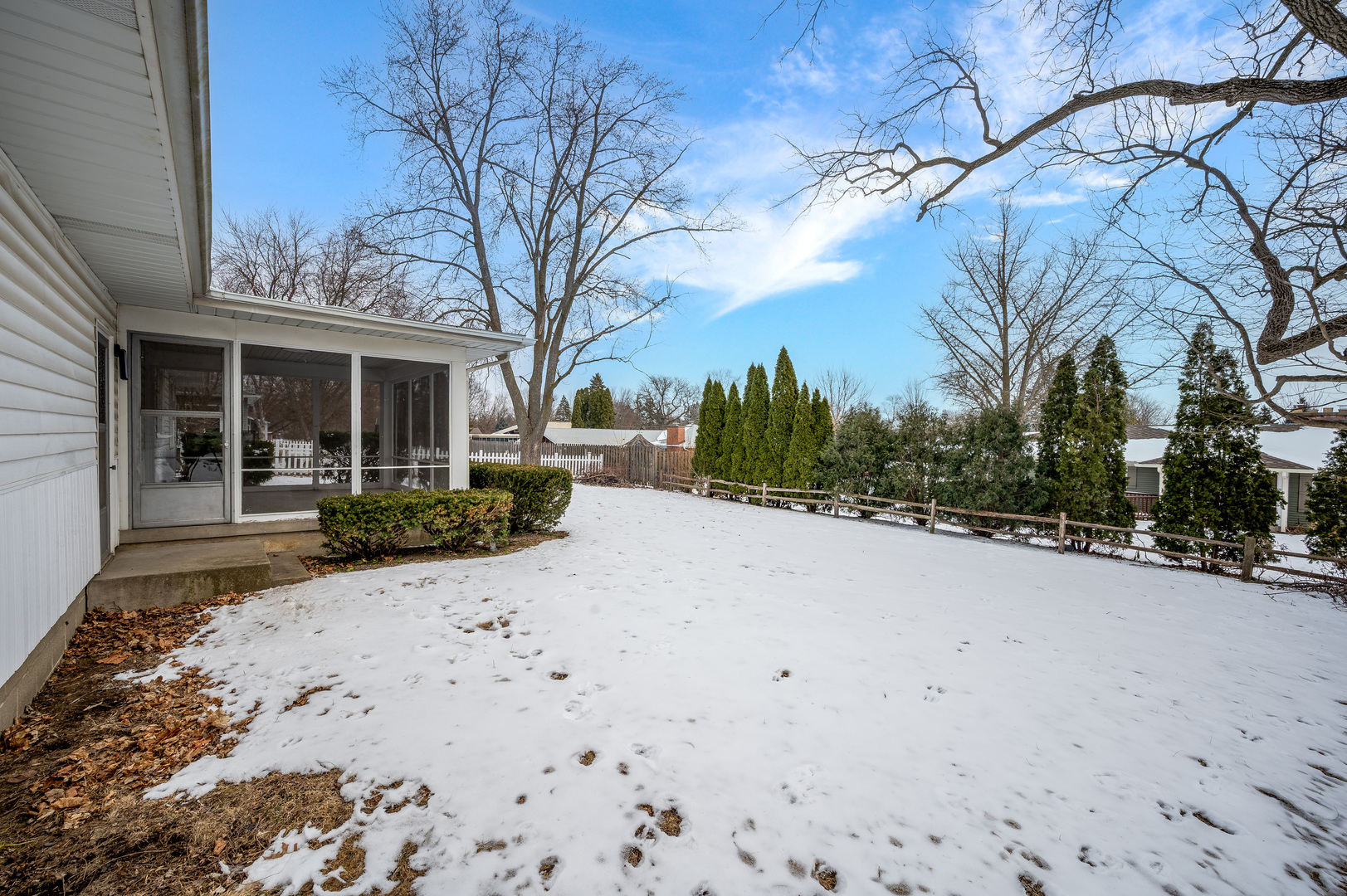 804 Normal Road DeKalb, IL 60115 - Photo 6 of 27 a view of a house with a snow in the yard