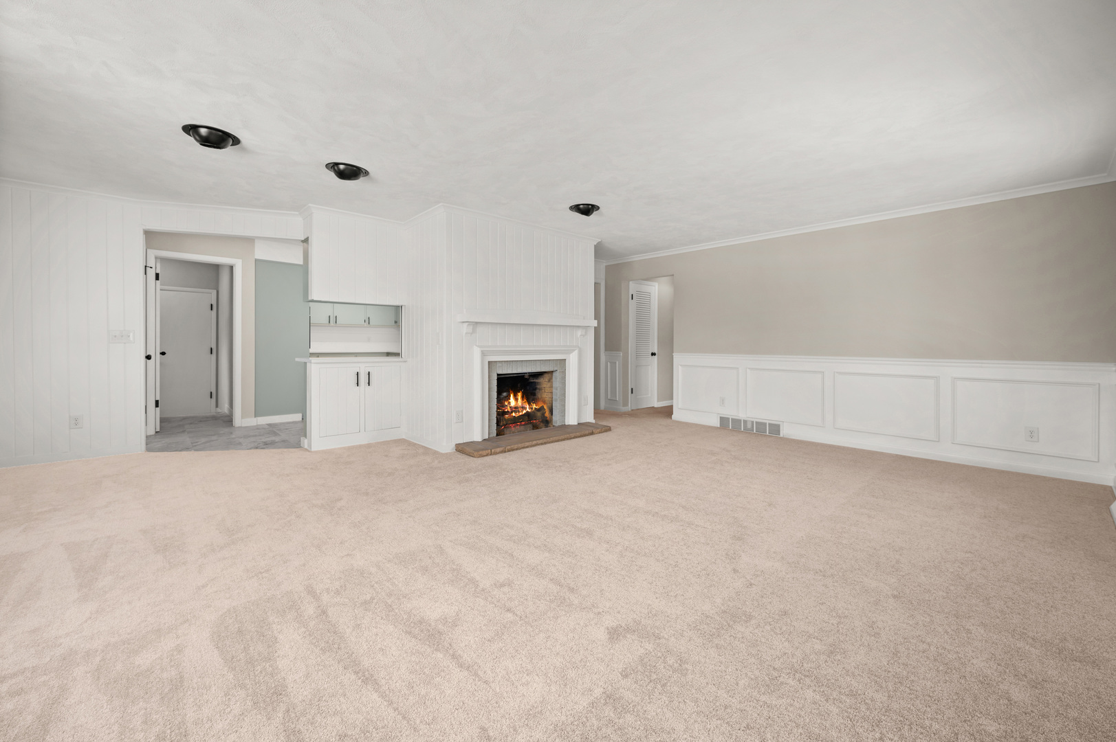 804 Normal Road DeKalb, IL 60115 - Photo 9 of 27 a view of empty room with a fireplace and cabinet
