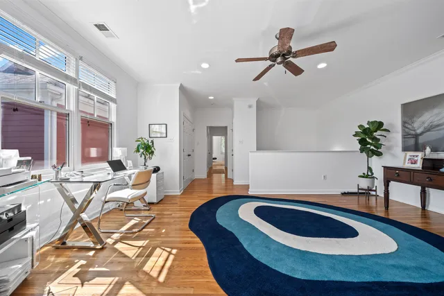a living room with furniture and a rug