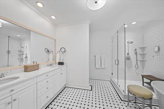 a spacious bathroom with a granite countertop sink a toilet a mirror and shower