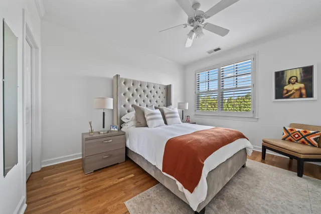 a spacious bedroom with a bed and a window