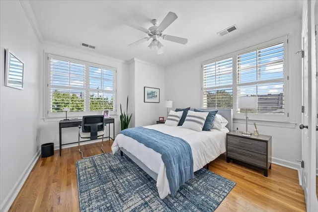 a bedroom with a large bed and a window