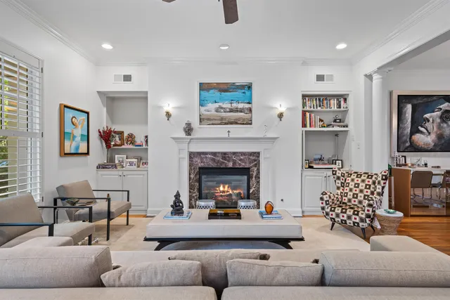 a living room with furniture and a fireplace